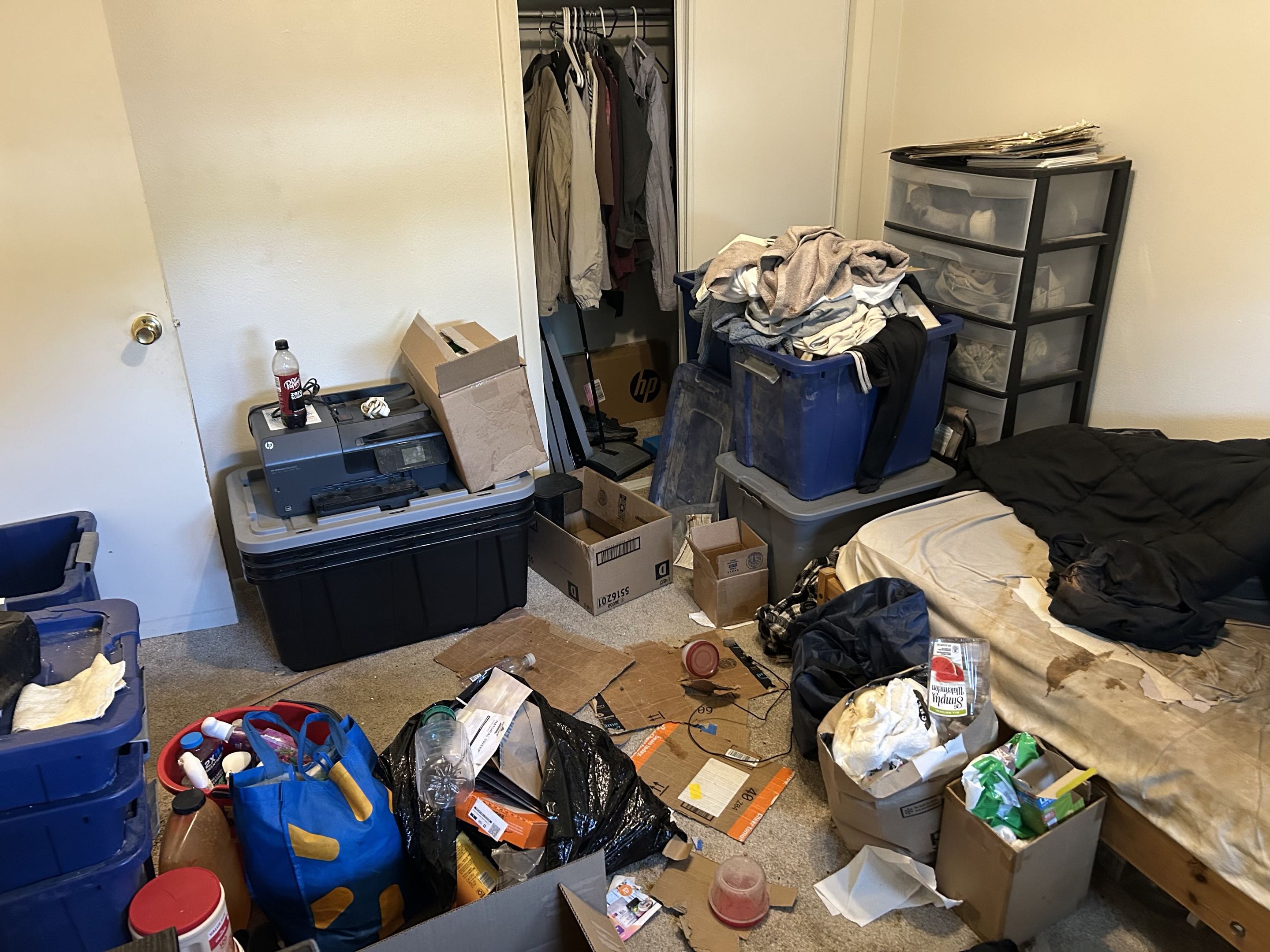 Cluttered bedroom before cleaning