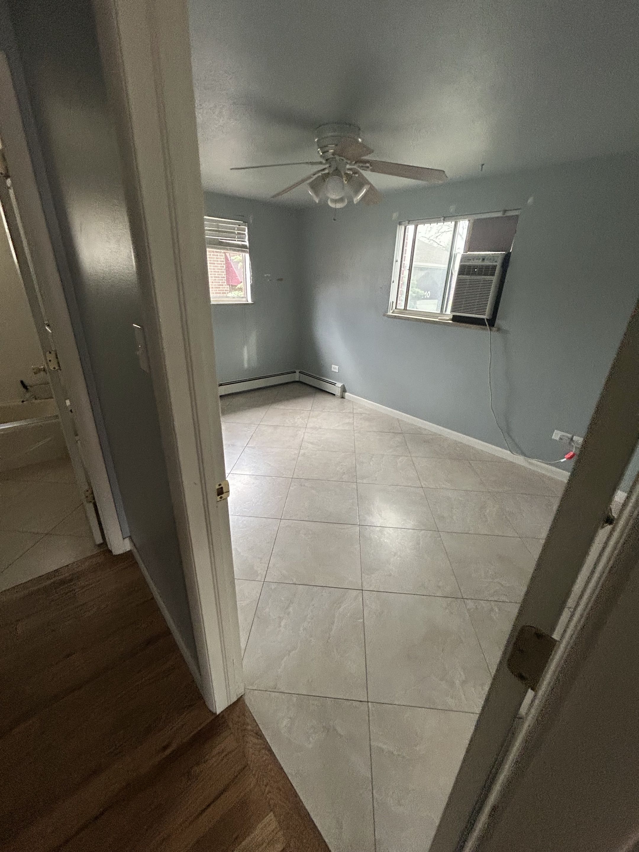 Freshly cleaned bedroom with tile flooring
